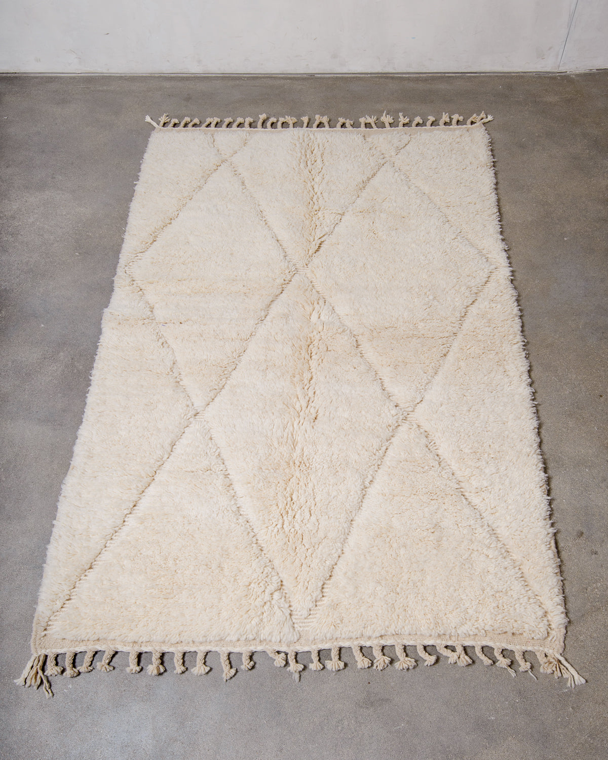 Modern, designer, handcrafted Berber rug from Morocco. Beniourain carpet with minimalist design, natural wool pile and a fluffy texture.